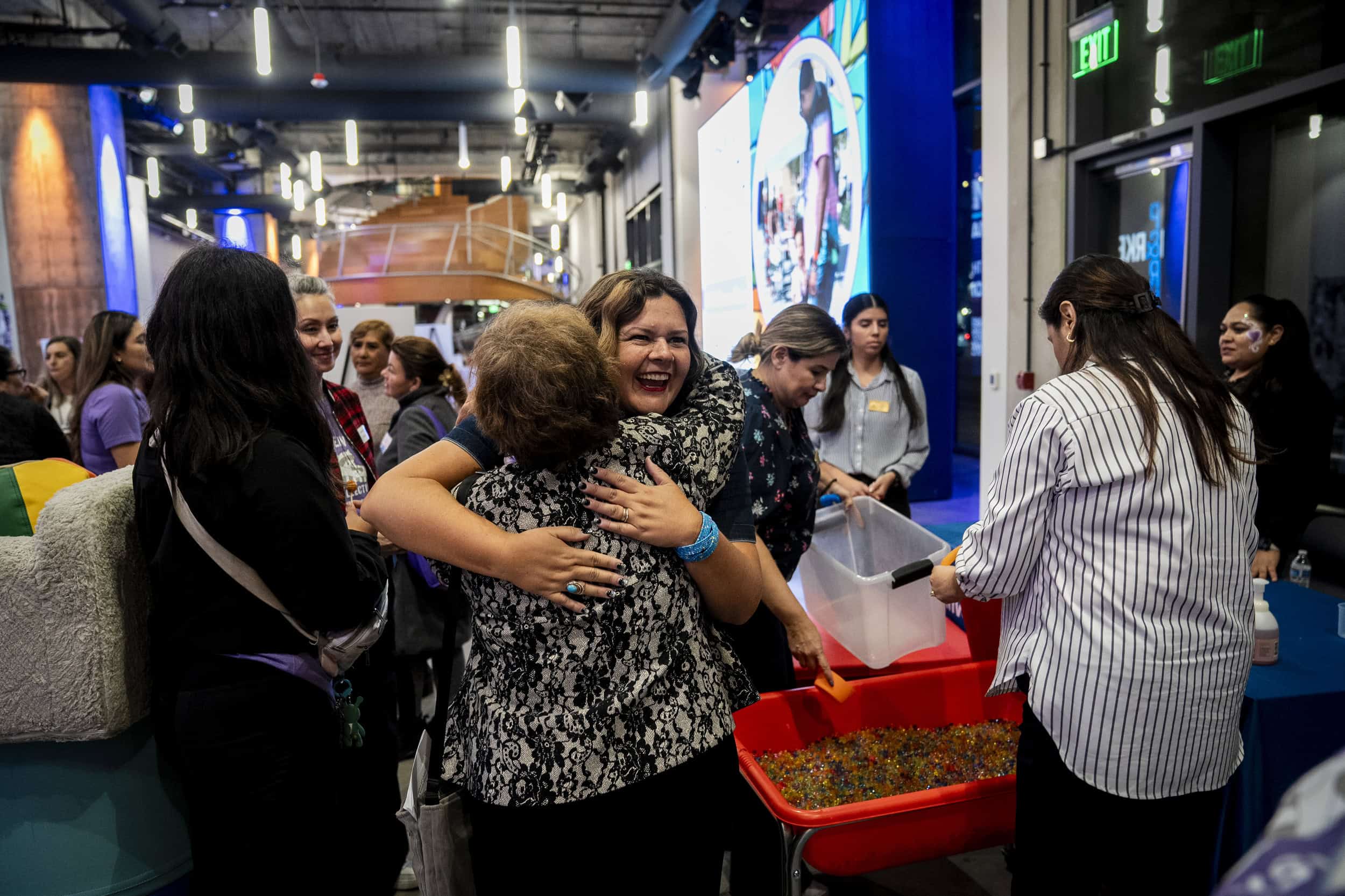 Advocates embrace at the We Choose Care event