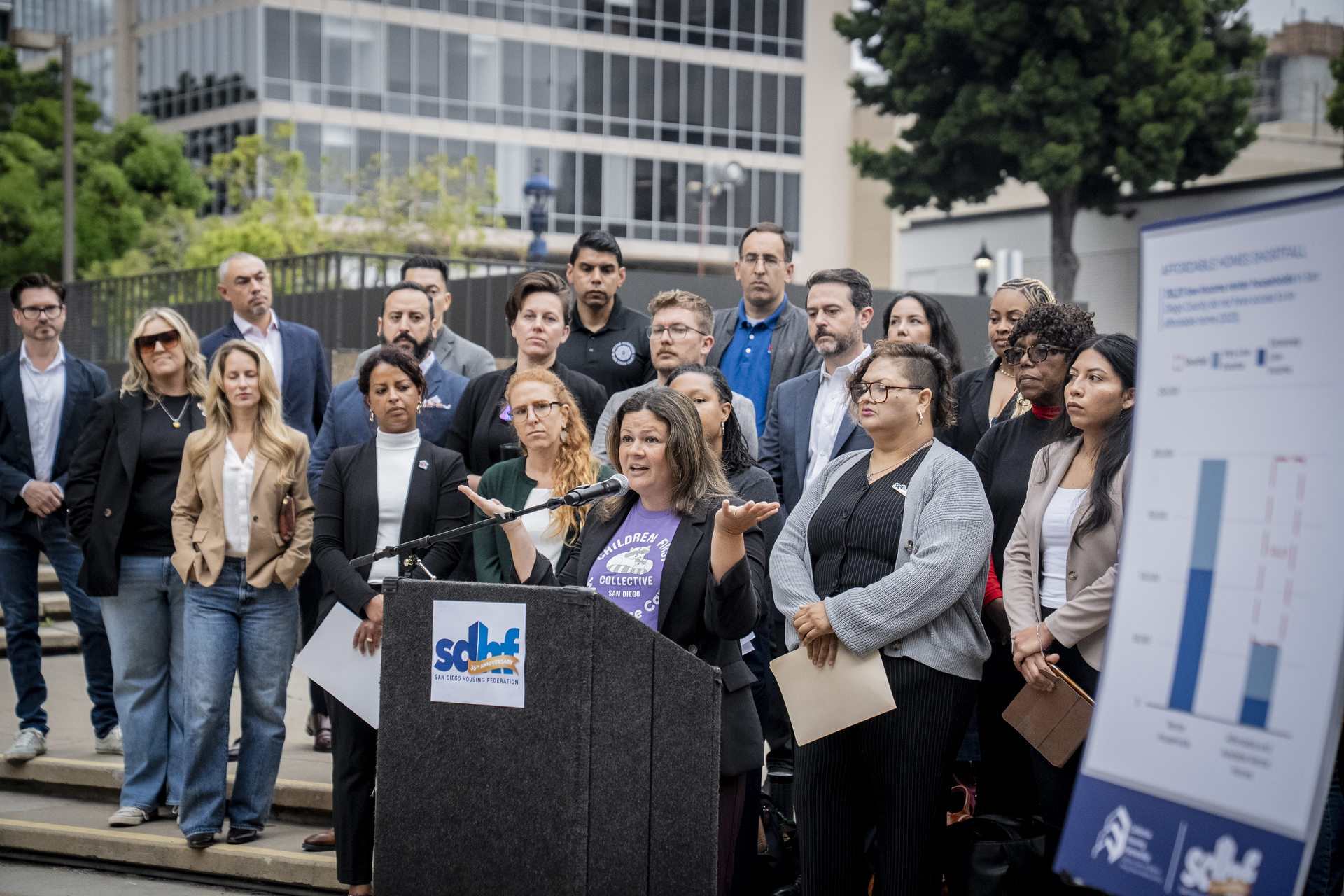 Courtney Baltiyskyy, vice president of public policy at the YMCA of San Diego County and co-facilitator of the Children First Collective and other local leaders gather in Civic Center Concourse to share findings from recent reports that underscore the challenges the region faces related to housing, child care, honmelessnessw and food insecurity on Thursday, May 6, 2025 in San Diego, California.